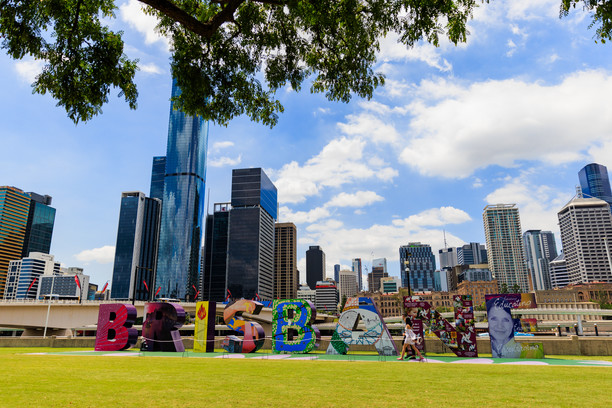 Colourful Brisbane letters in front of the skyline