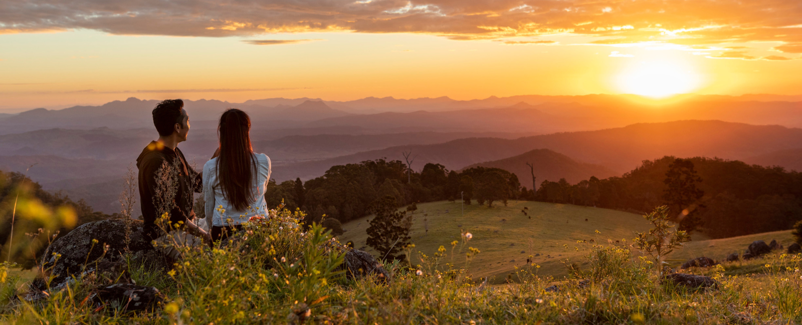 Couple overlooking sunset at Lamington National Park