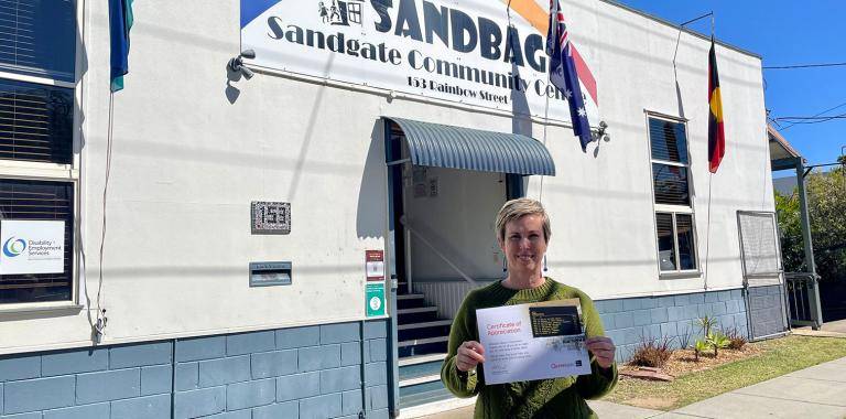SANDBAG's Erin Williams standing in front of the Sandgate Community Centre